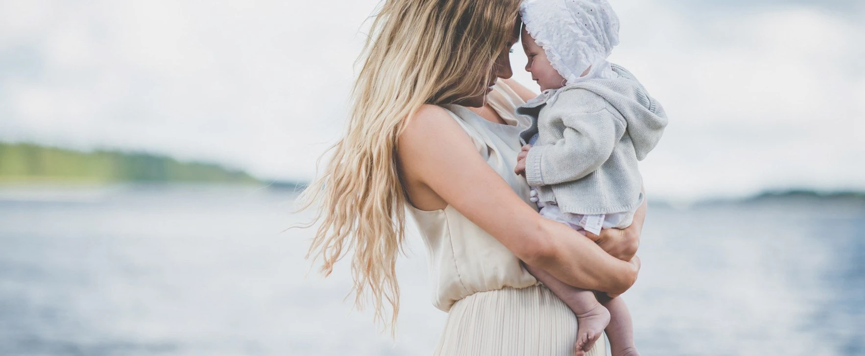 A picture of a woman holding a baby